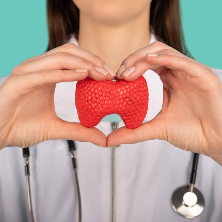 female-doctor-with-stethoscope-is-holding-mockup-thyroid-gland-help-care-concept-min